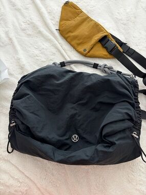 lululemon athletica Black Duffel with Mustard Sling Accent crossbody